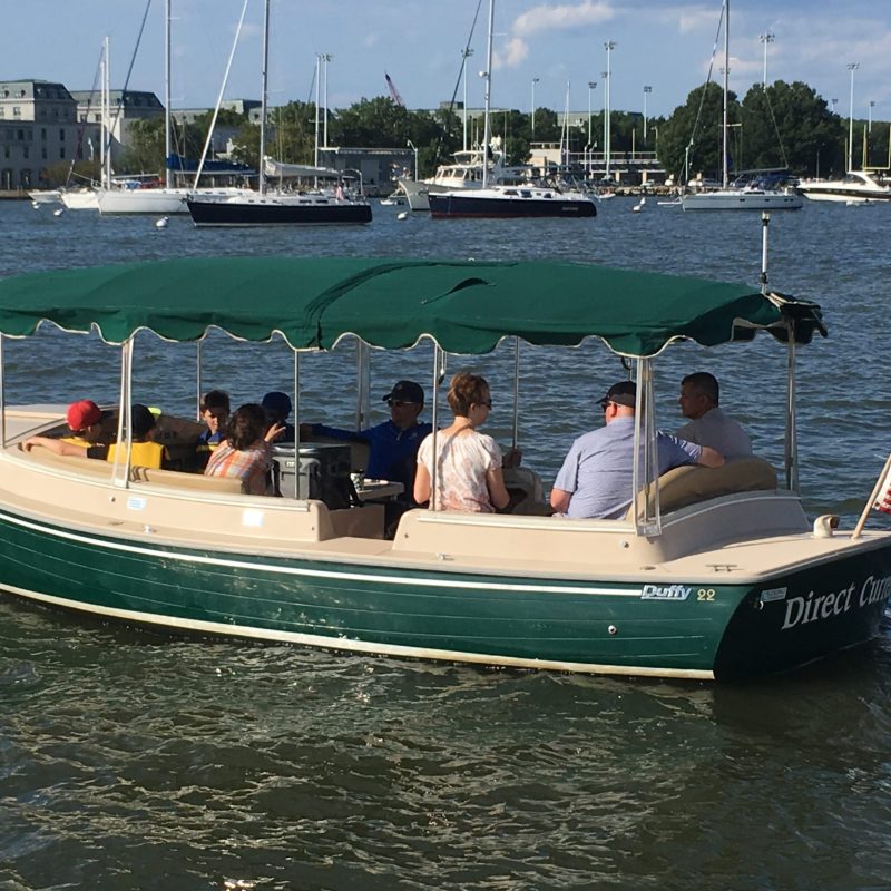 a group of people on a boat in the water