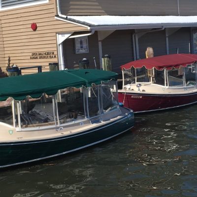 a boat is docked next to a body of water