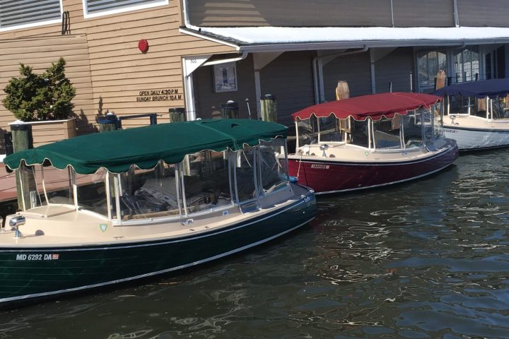 a boat is docked next to a body of water