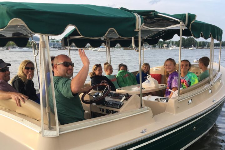 Ashleigh Barty et al. on a boat in the water