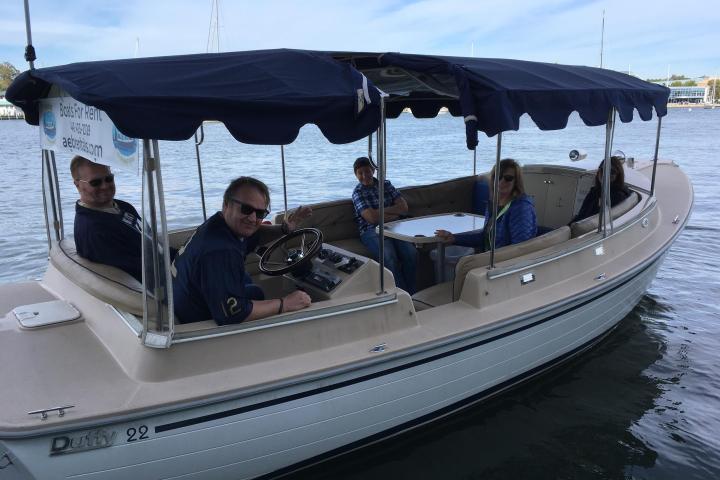 a group of people on a boat in the water