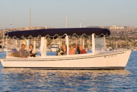 a group of people in a boat on a body of water
