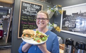 a person holding a plate of food