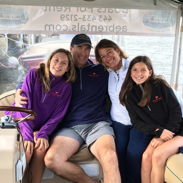 Ariele Sieling et al. sitting on a bench posing for the camera